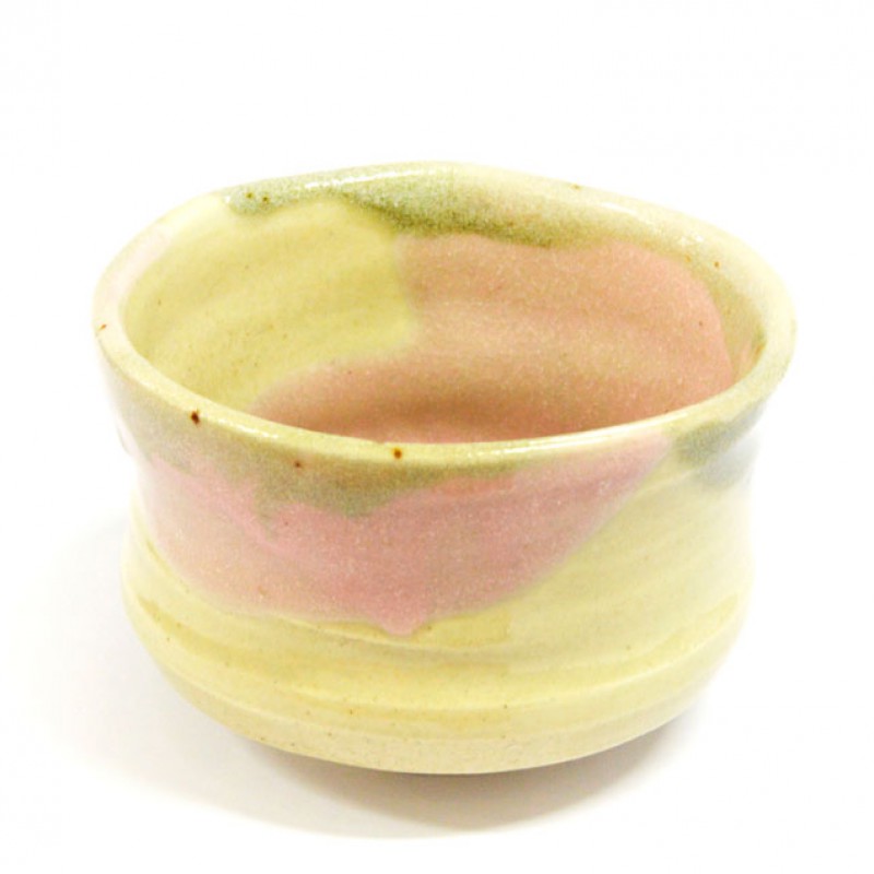 Person placing task list card into walnut card holder next to felt carrying case on leather desk pad.